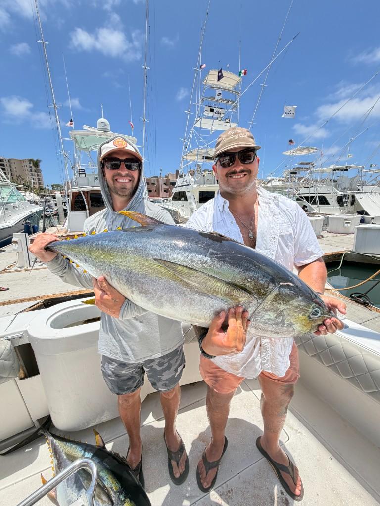 Guests with yellowfin tuna after a Nasty Sport Fishing charter in Cabo San Lucas